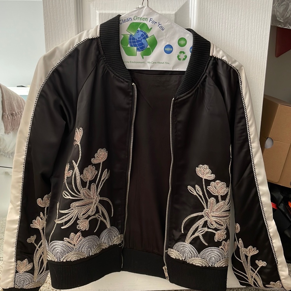 Dance and marvel bomber jacket with knitted flower embellishments